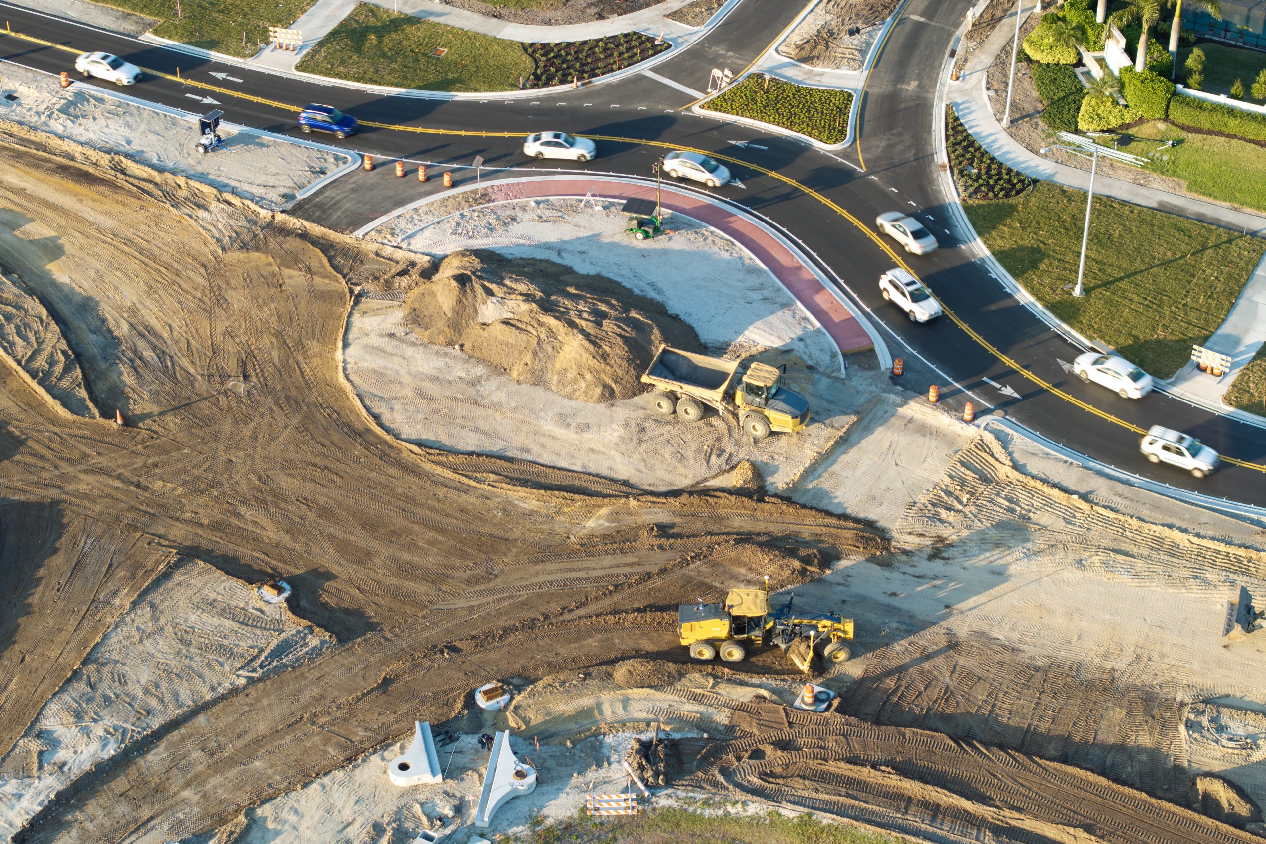 Land development construction timeline in Alberta showing grading, utilities, and road installation